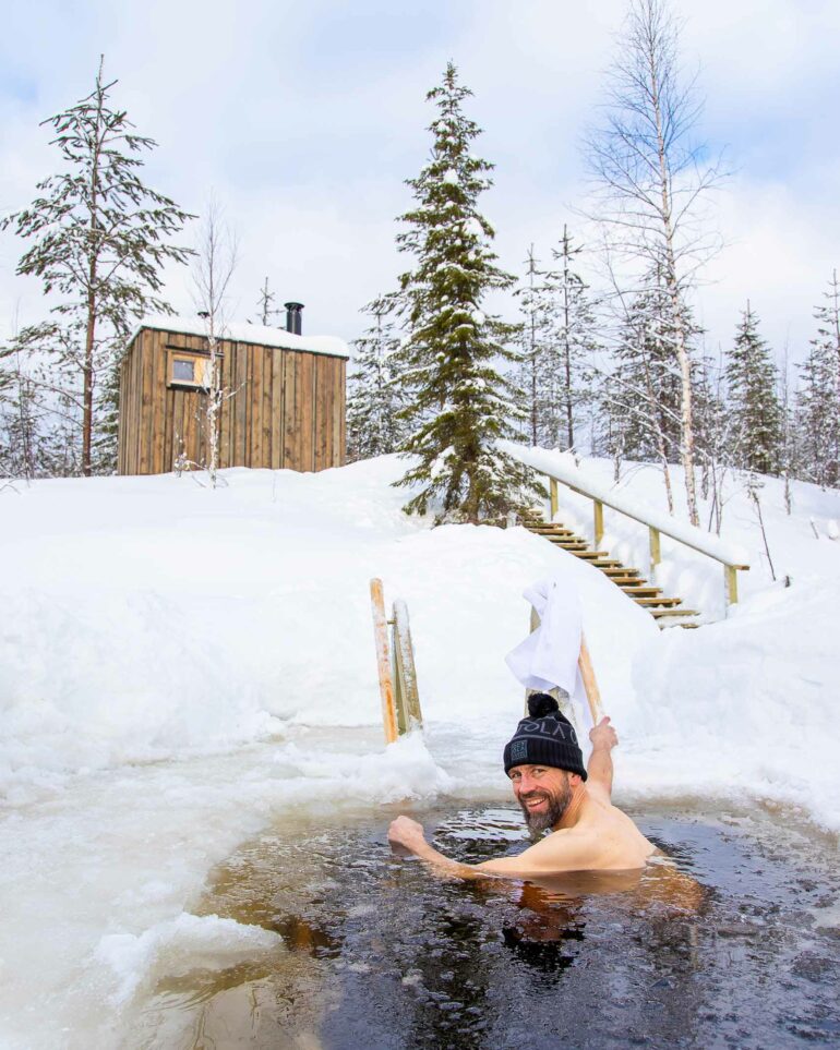 A man takes a dip in freezing waters in the Arctic Circle, Finland