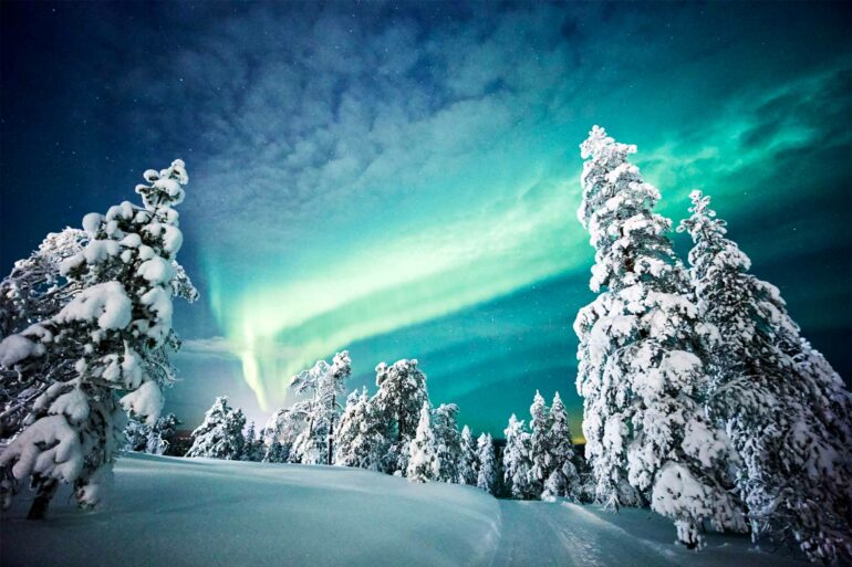 The Aurora Borealis lights up the night sky in the Arctic Circle, Finland