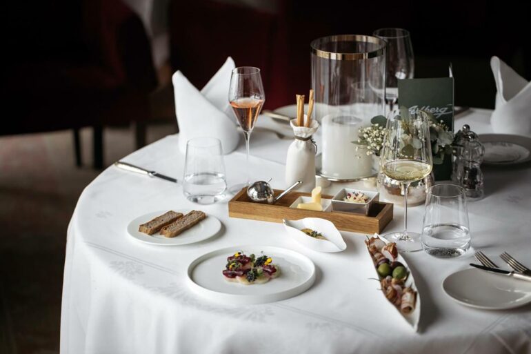 A meal is served at the restaurant at Hotel Arlberg, Lech, Austria