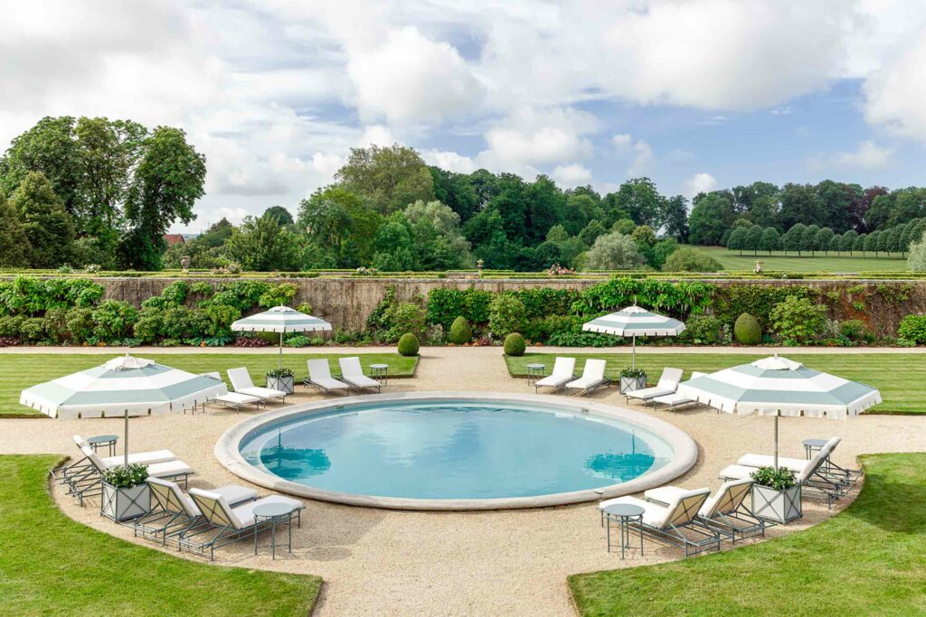 The pool at the Hotel Château du Grand-Lucê, Pays de la Loire, France, one of the most glamorous homes turned hotels