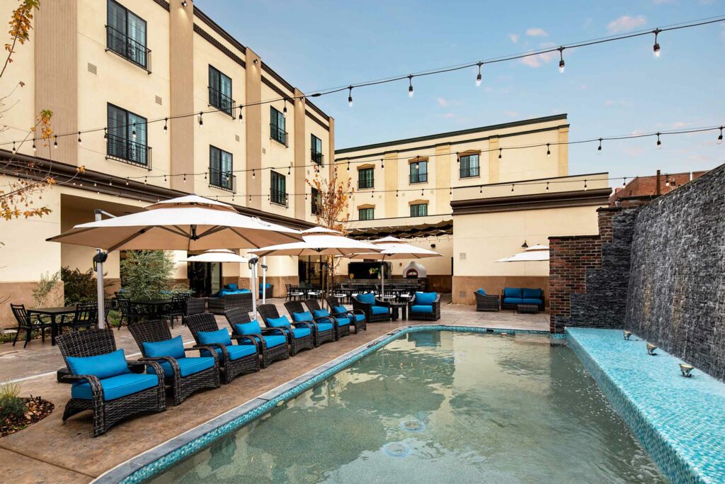 Outdoor pool with sun loungers at Hotel Winters, Winters, California, USA. 