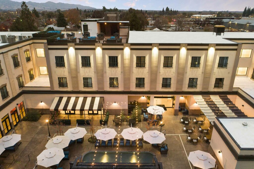 Birdseye view of Hotel Winters with sun loungers and umbrellas visible. 