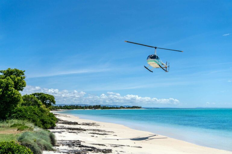 A helicopter lands on the beach in Nosy Ankao, Madagascar