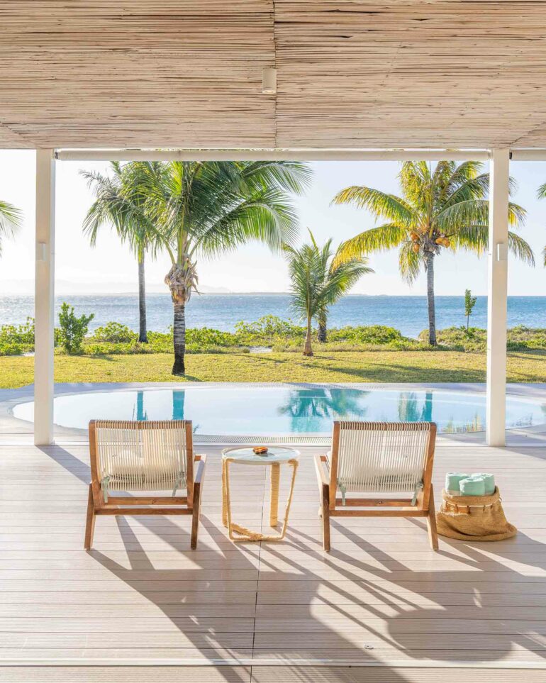 Two chairs stand by a pool with a view over the sea at Miavana by Time + Tide, Nosy Ankao, Madagascar
