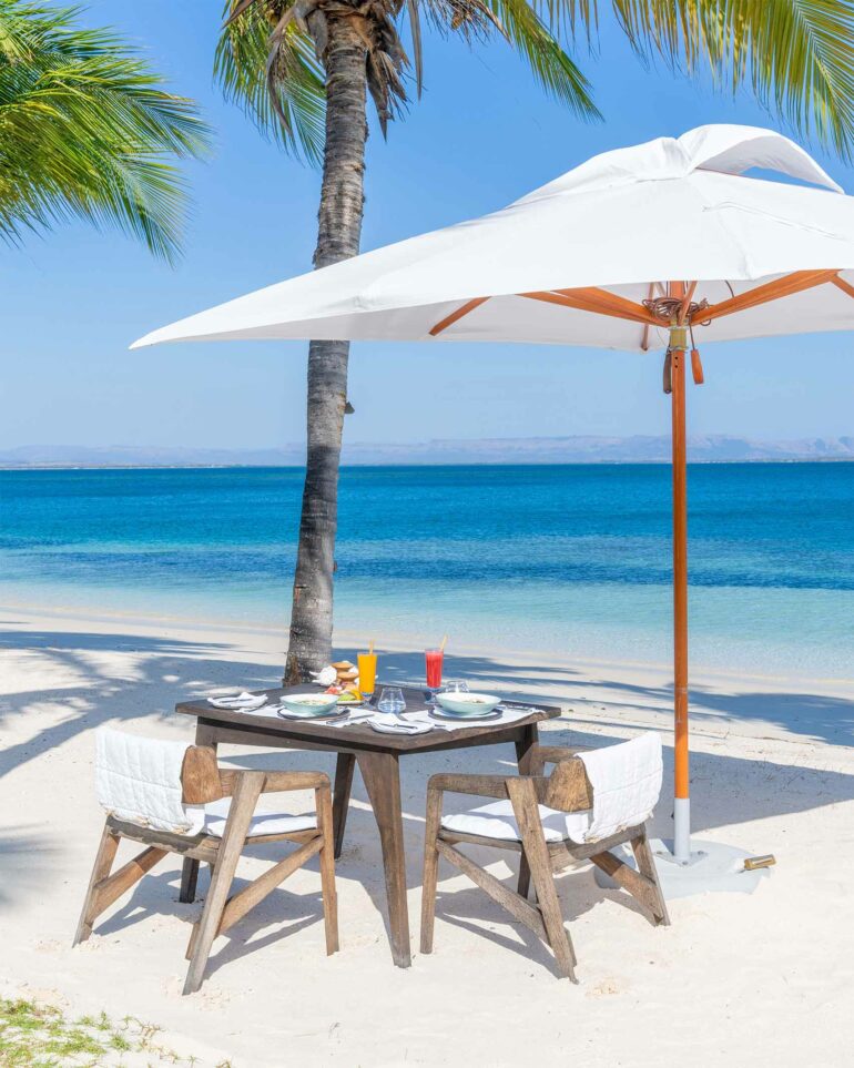 A beachside lunch setup at Miavana by Time + Tide, Nosy Ankao, Madagascar