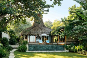 A villa sits between trees at NIHI Sumba, Sumba, Indonesia