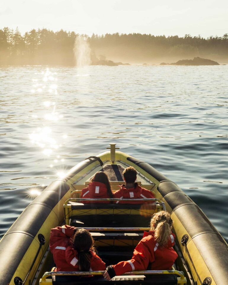 Visitors on a boat in Tofino, Vancouver Island, Canada