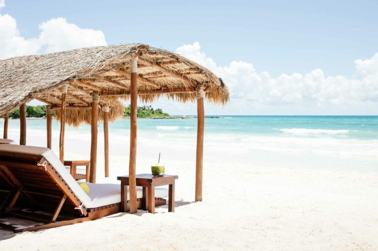 Beachside loungers at Hotel Esencia, Xpu-Ha, Mexico