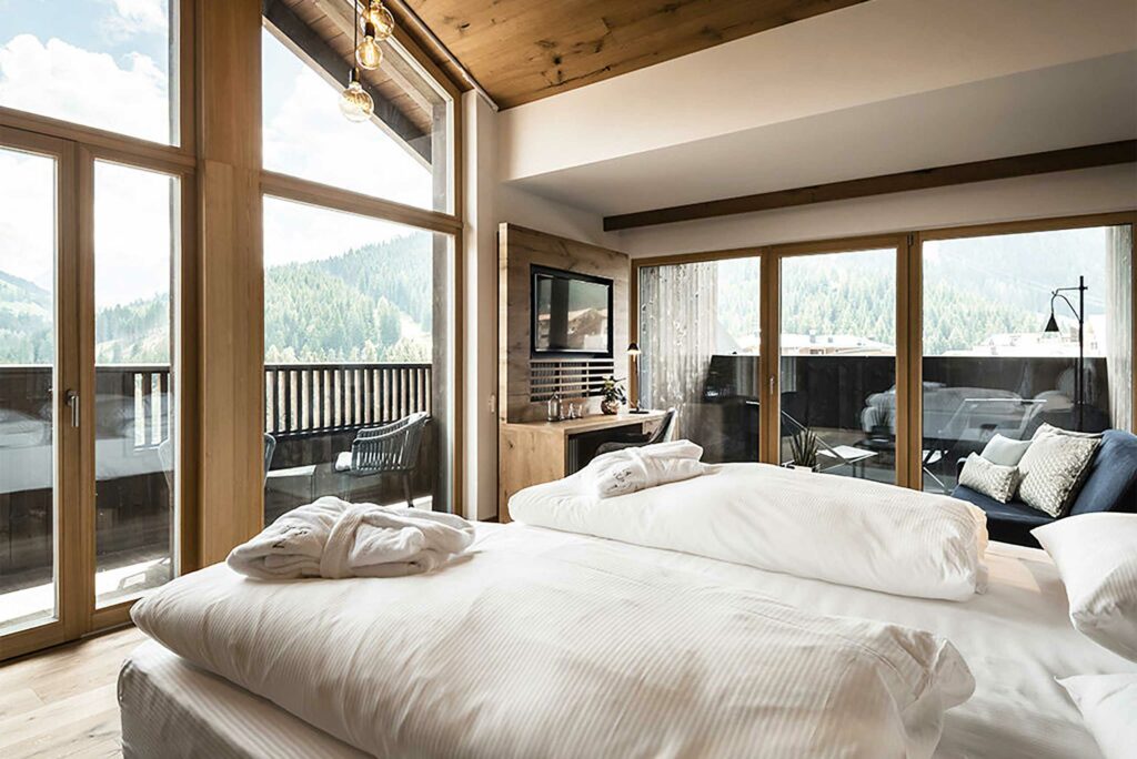 A bedroom at Hotel La Majun, La Villa, Alta Badia, Italy