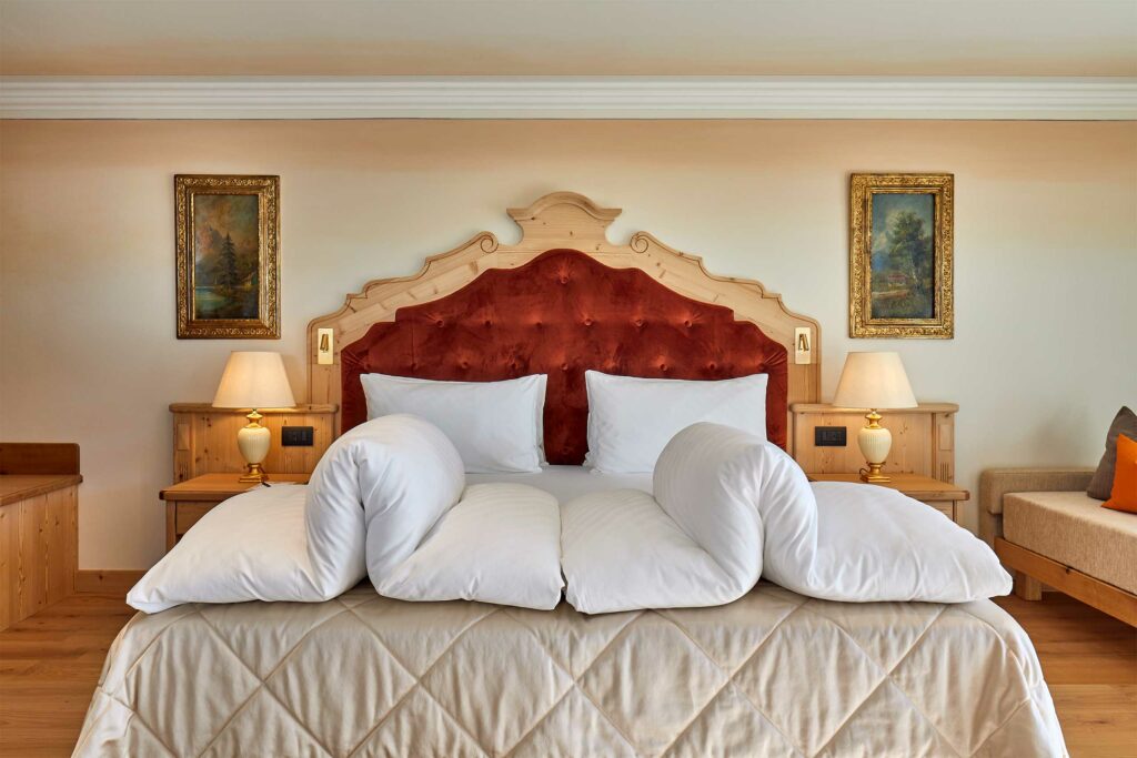 A bedroom at Hotel Sassongher, Corvara, Alta Badia, Italy