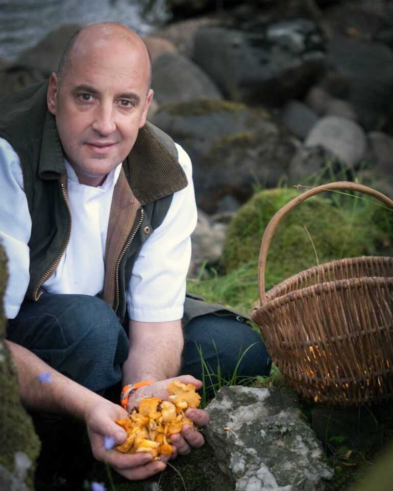 A local Scotsman forages wild mushrooms, which form an important part of Scottish cuisine. Perthshire, Scotland