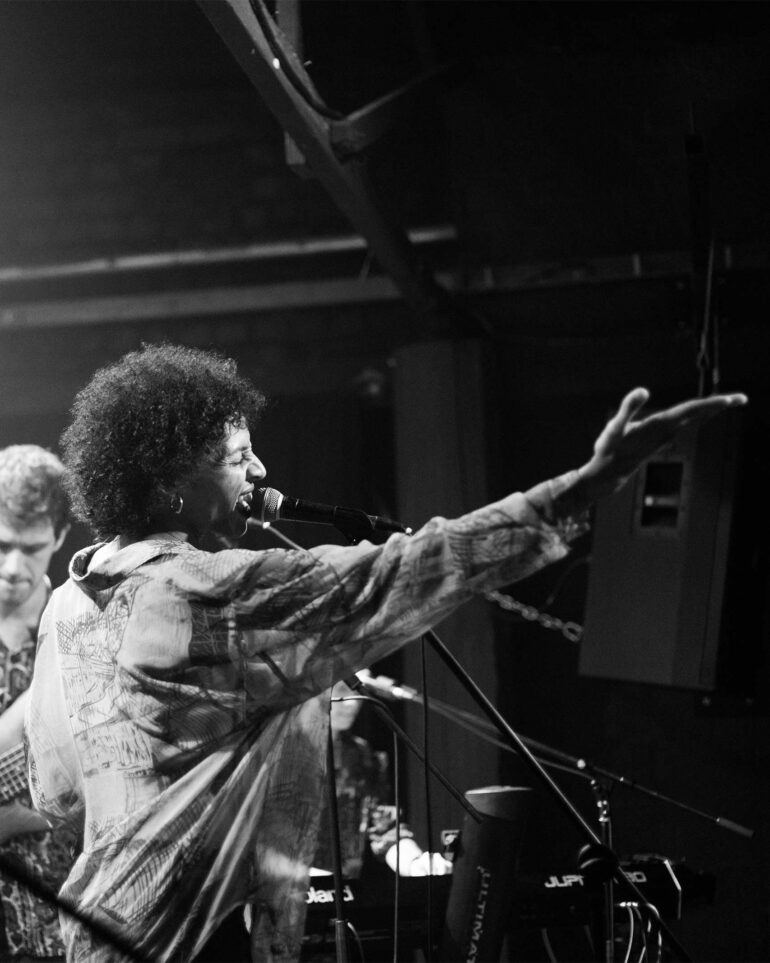 Al Clapper sings in front of a crowd in Cape Town, South Africa