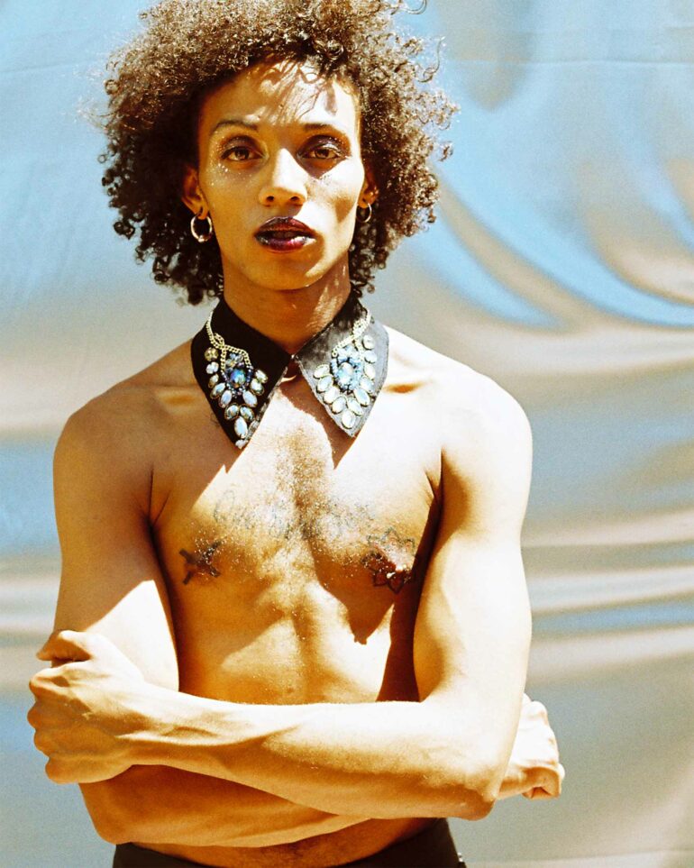 Singer Al Clapper poses topless in Cape Town, South Africa
