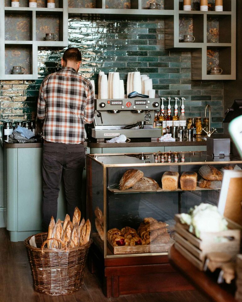A coffee is prepared for a customer at The Bear's Larder, Edinburgh, Scotland