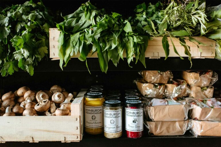 Preserved goods and fresh produce line the shelves of The Bear's Larder, Edinburgh, Scotland
