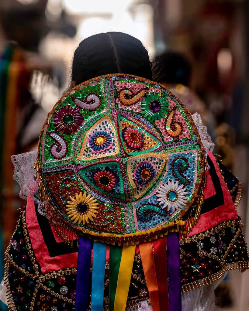 A Peruvian woman wearing traditional dress. The Explorations Company supports women across Peru