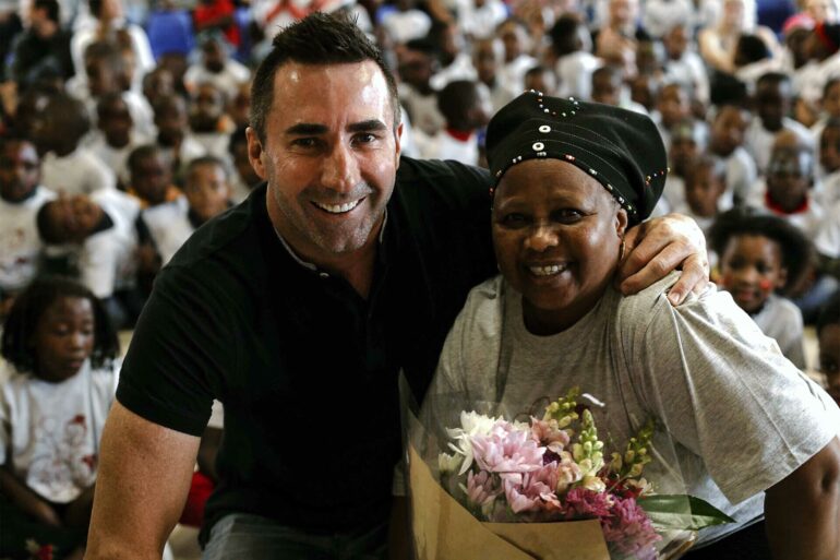 David Ryan poses for a picture with a fellow South African in Cape Town, South Africa
