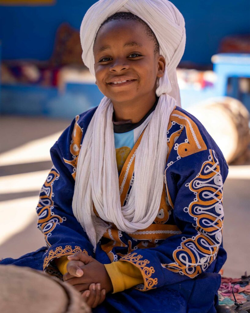 A Moroccan child smiles for the camera.