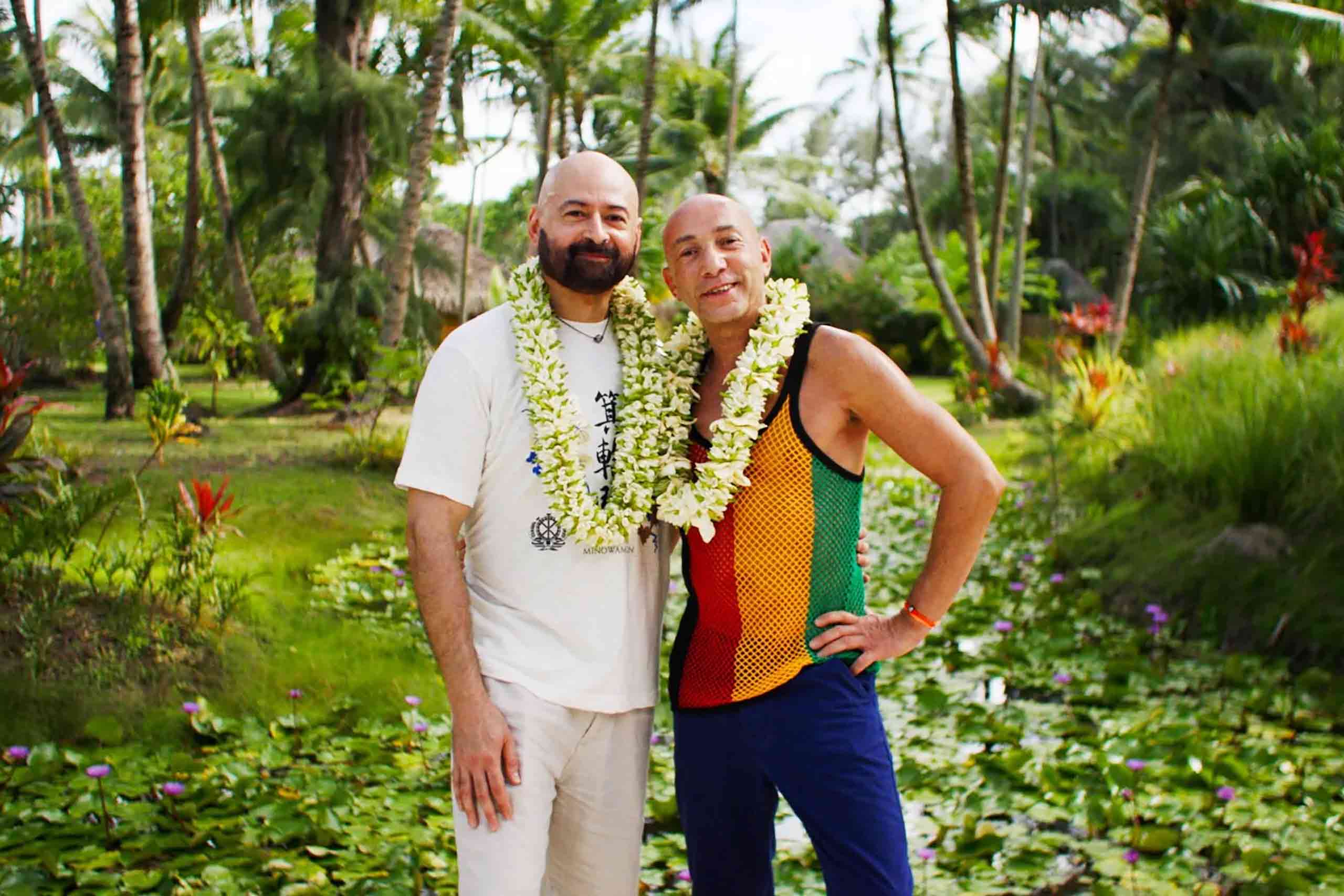 A queer copy pose with flower necklaces as part of a Tahiti Tourisme campaign; 'The Treasured Test'