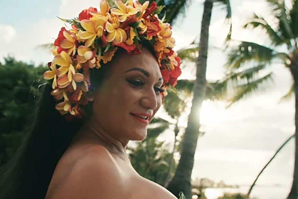 A queer Tahitian performer as seen in 'The Treasured Test' campaign by Tahiti Tourisme.