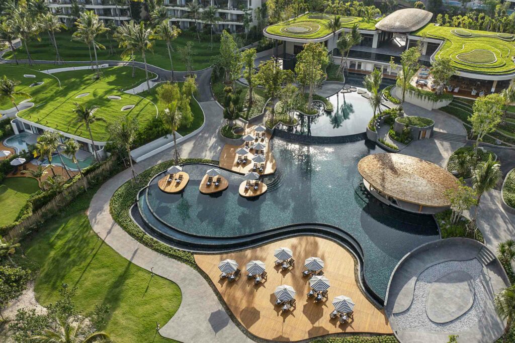 Overhead view of Anantara Koh Yao Yai's curved pools and winding roads.