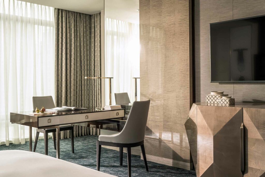 A desk and chair in a minimal and stylish suite.