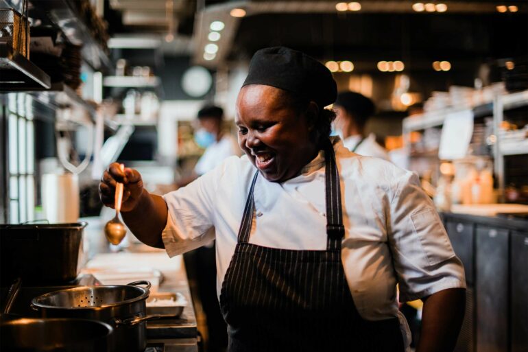 A cook prepares a meal at Test Kitchen Fledgelings, Cape Town, South Africa