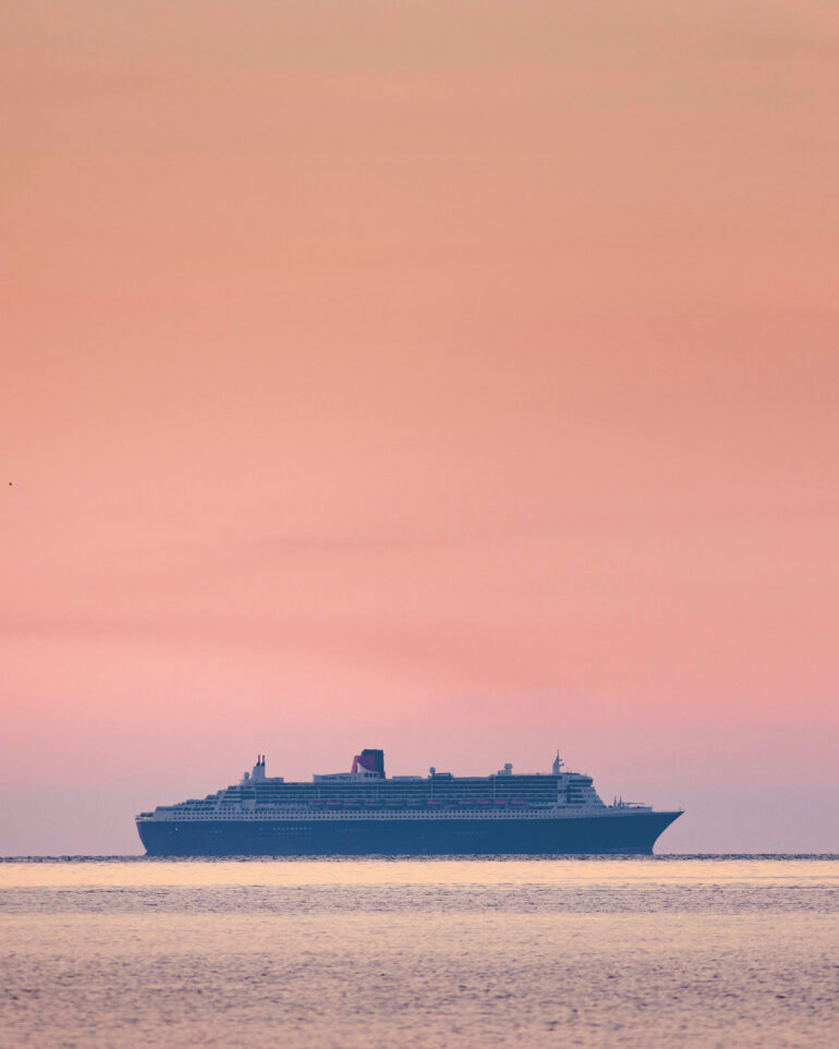 The sun sets over Queen Mary 2, Cunard