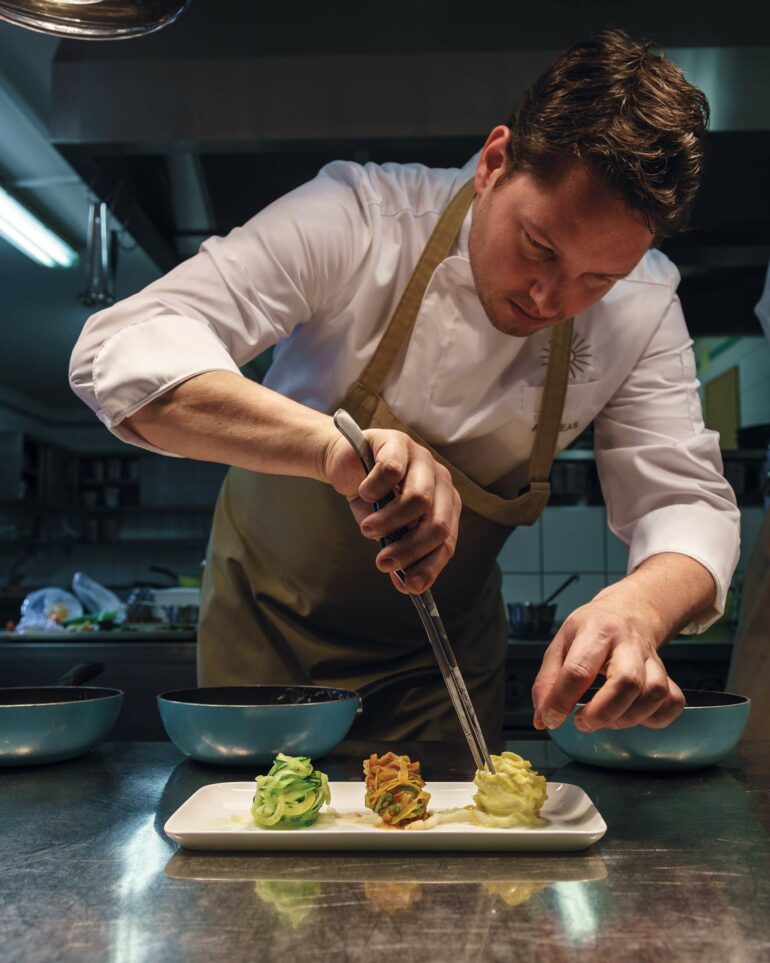 A chef prepares a meal at The Original FX Mayr, Lake Wörthersee, Austria