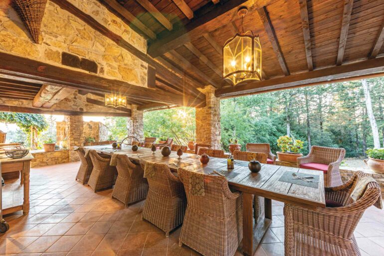 A large table is set for a meal at Villa Ardore, Tuscany, Italy