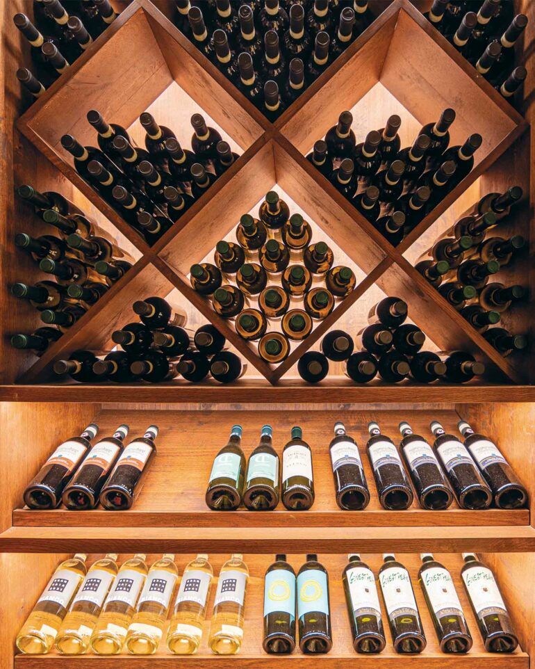 Wine bottles in a cellar in Tuscany, Italy