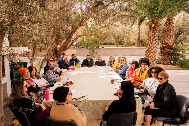 Attendees of a writing retreat discuss their work, Silk Road Slippers, Marrakech, Morocco