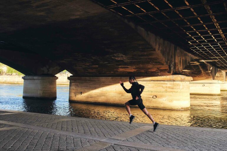 Koko Barno goes running in the streets of Paris, France