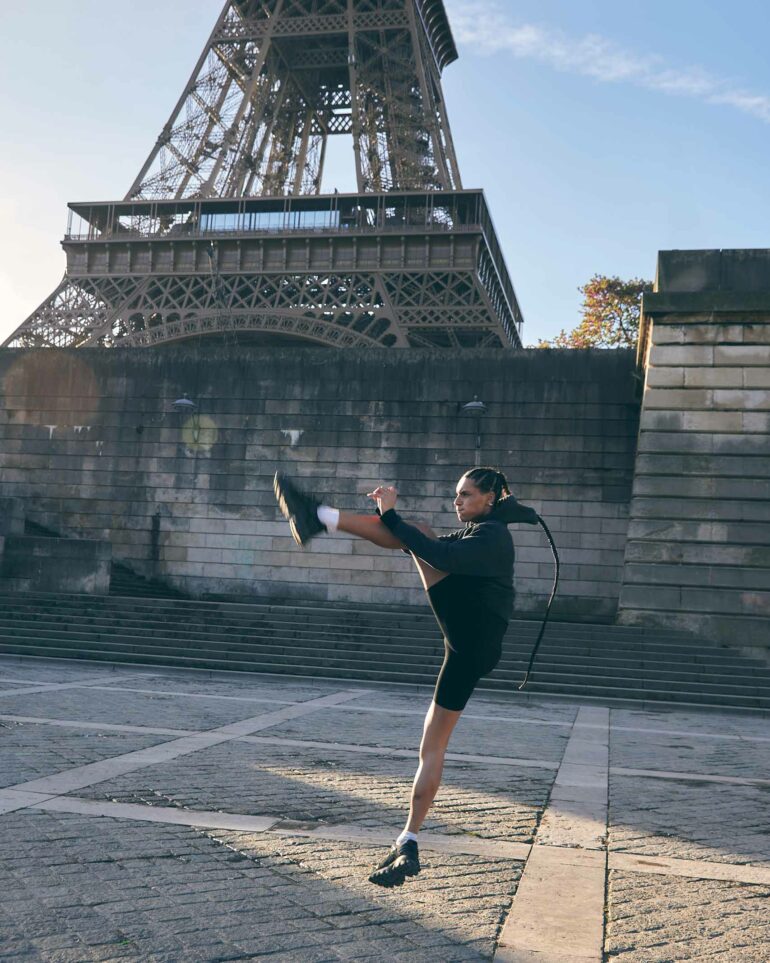 Koko Barno works out near the Eiffel Tower in Paris, France