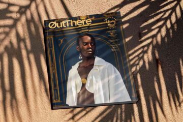Salvador Rising Issue of OutThere in shadows of palm fronds