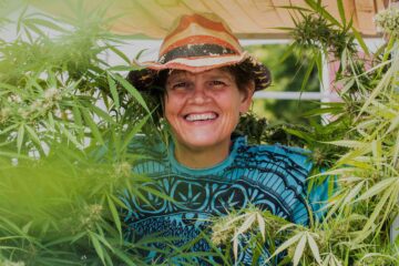 Woman in marijuana bush at Hempstock Pharms, Illinois