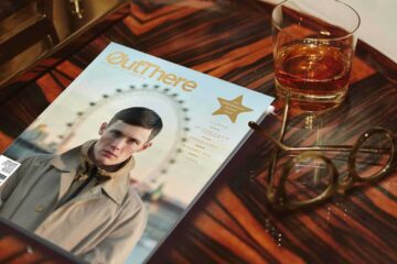 OutThere magazine on coffee table with whisky glass