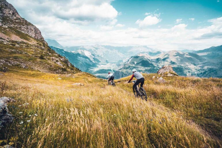 Bikers going down a hill in Les Deux Alpes, France
