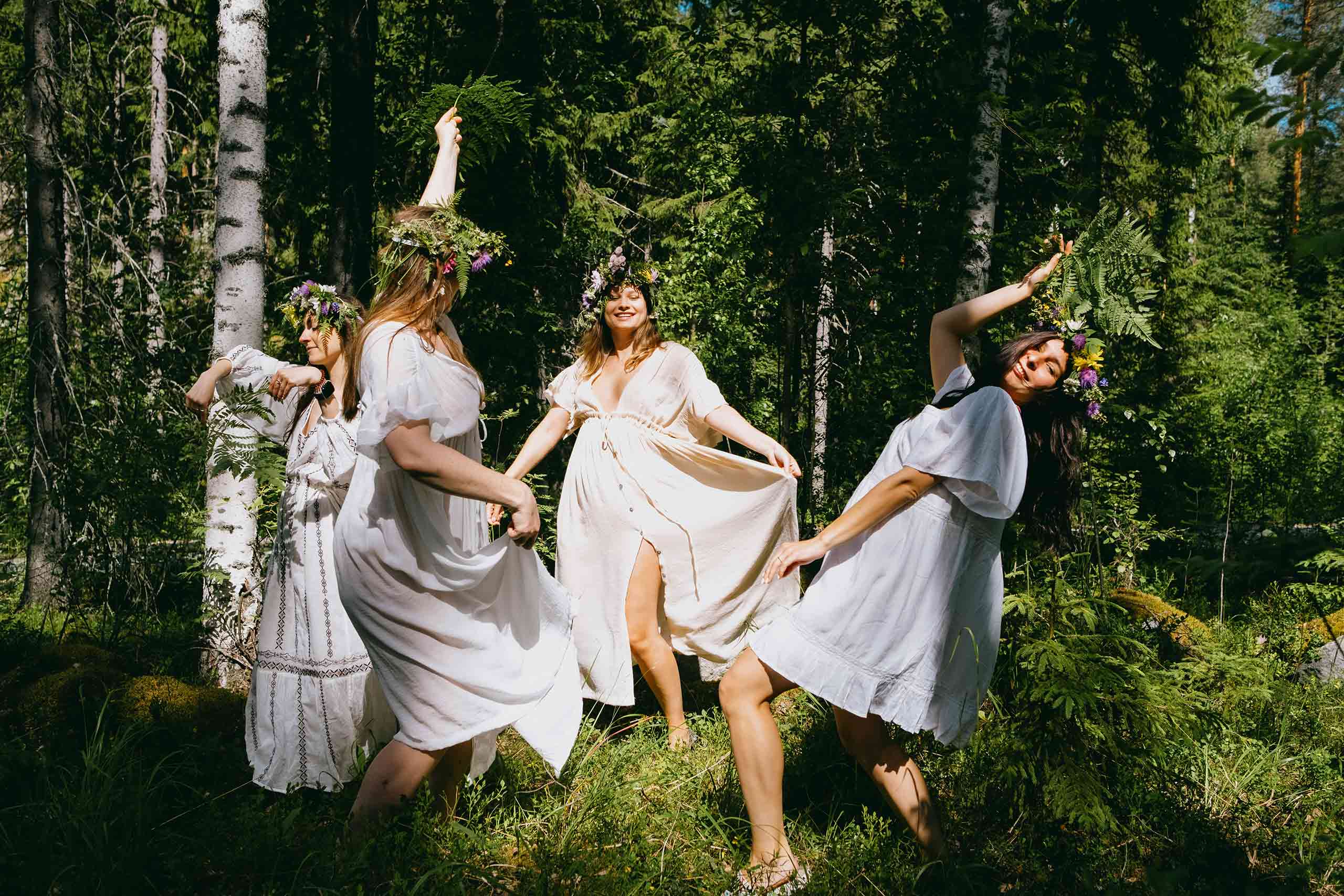 Women in forest during midsummer in Finland