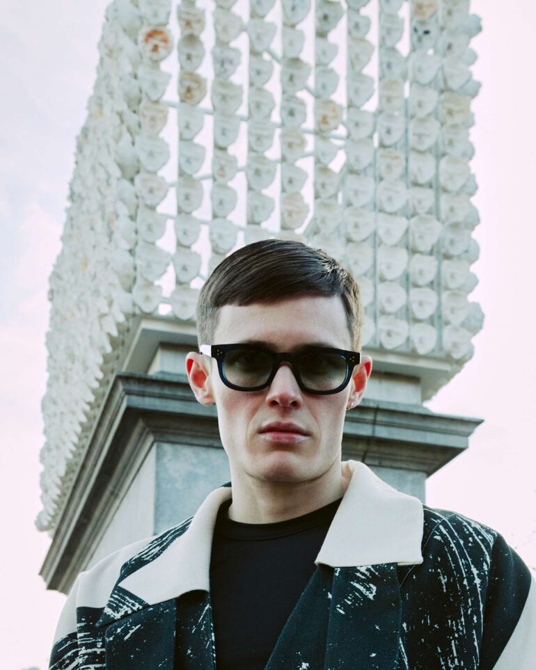 Jill Leflour poses in front of the fourth plinth in London, United Kingdom