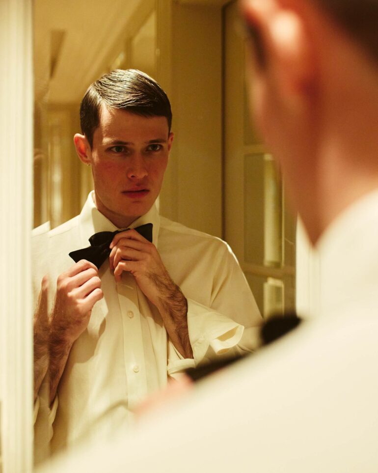 Jill Leflour puts on a tie at The Corinthia Hotel in London, United Kingdom