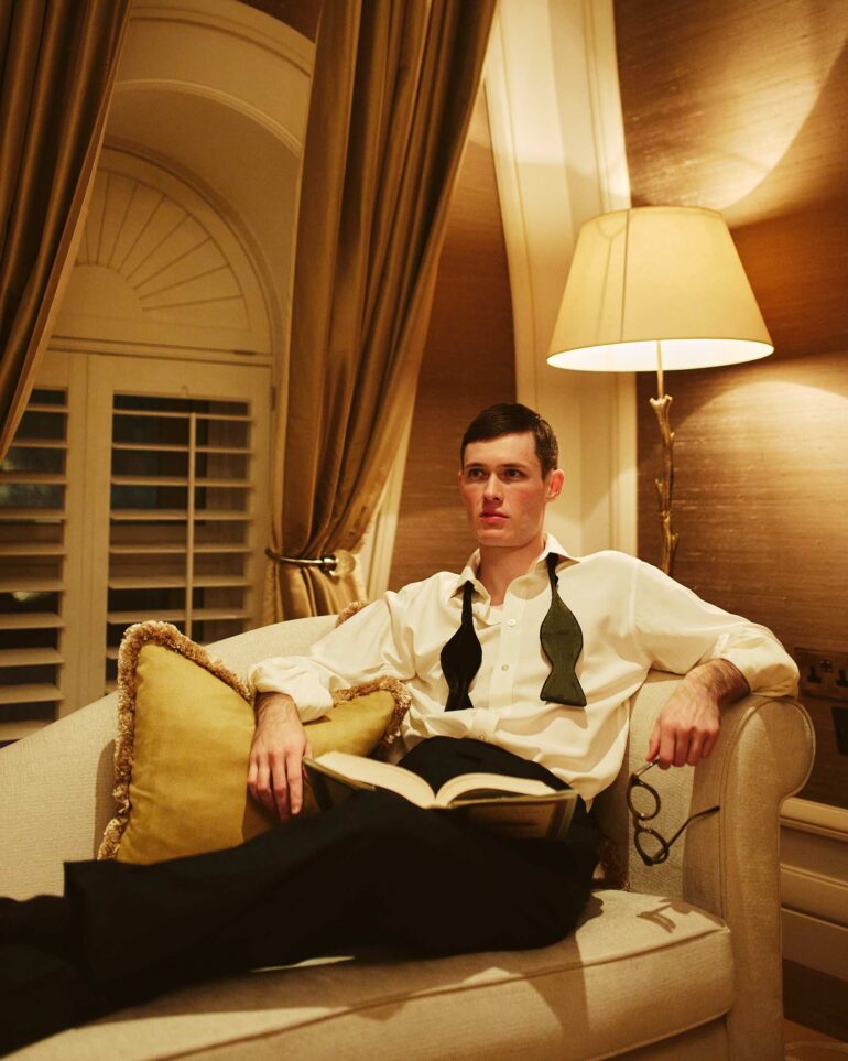Jill Leflour poses on a sofa at The Corinthia Hotel in London, United Kingdom