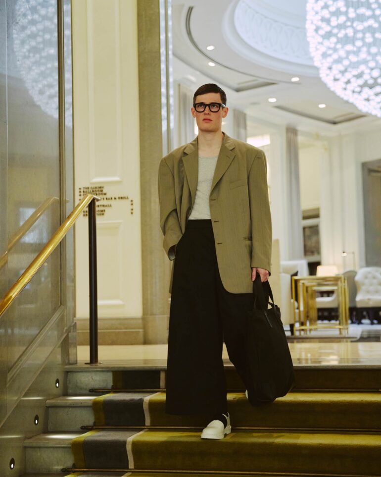 Jill Leflour descends stairs inside The Corinthia Hotel in London, United Kingdom