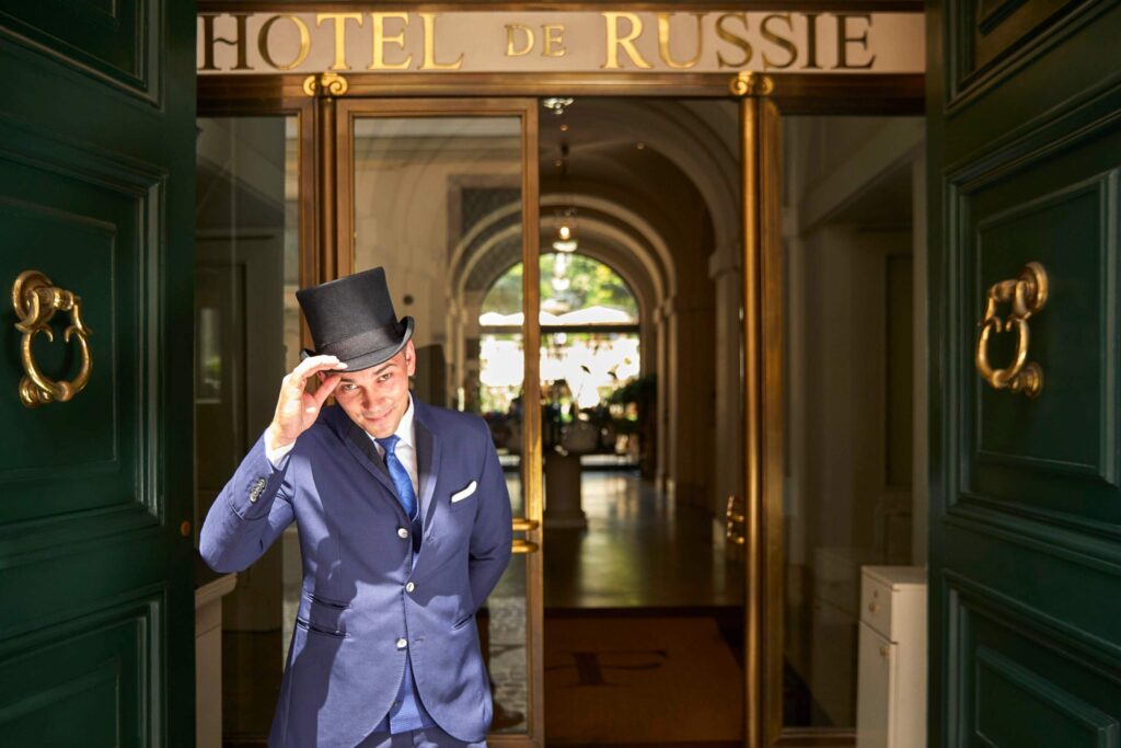 A doorman welcomes guests to the Hotel de Russie, a Rocco Forte Hotel, Rome, Italy