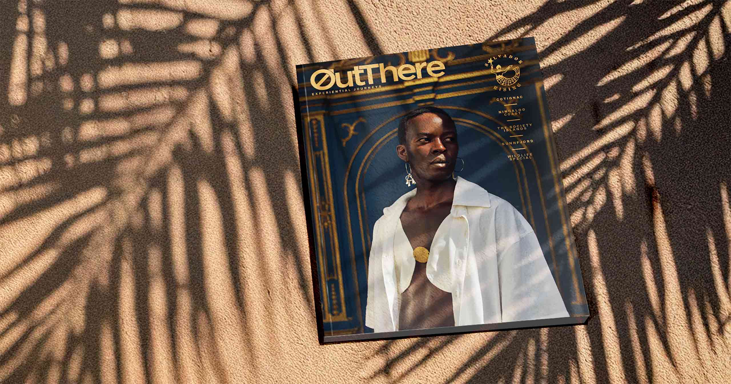 Salvador Rising Issue of OutThere in shadows of palm fronds