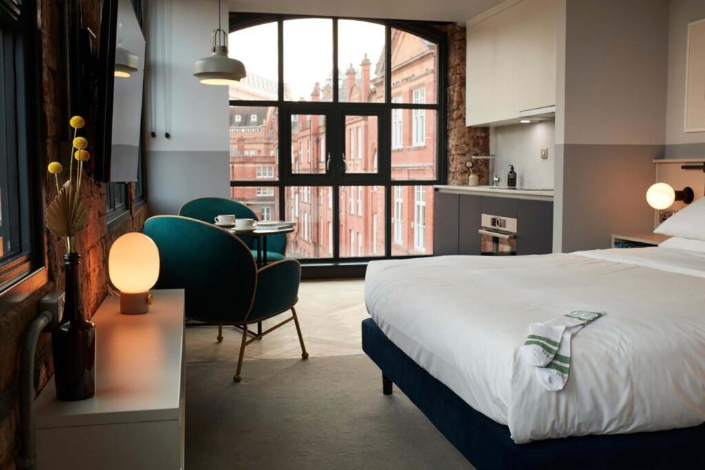 Loft room, with bed and big industrial window