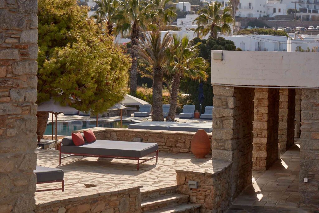 Poolside at Mykonos Theoxenia with its 1960s original boulder wall buildings