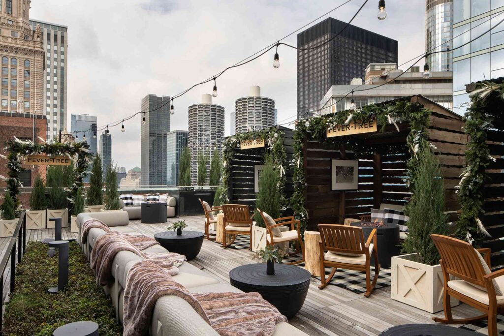 Chateau Carbide on the garden rooftop of the Carbon and Carbide building, with outdoor seating, shed books and rocking chairs.
