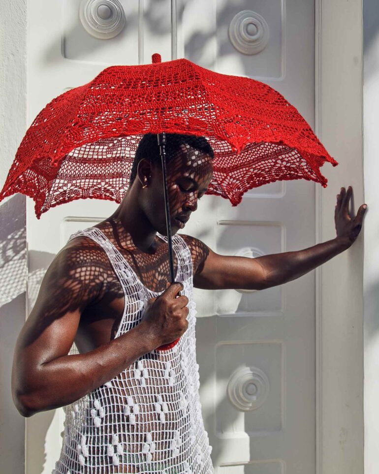 Fah Sampaio leans against a wall in Salvador, Brazil