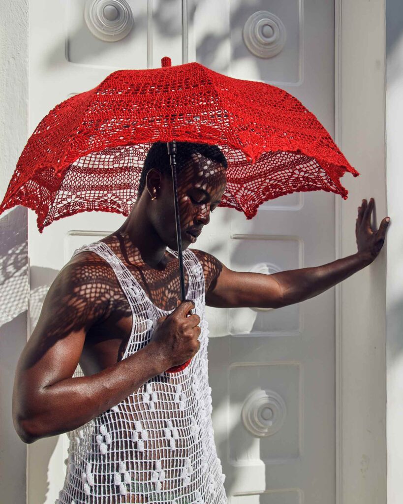 Fah Sampaio leans against a wall in Salvador, Brazil